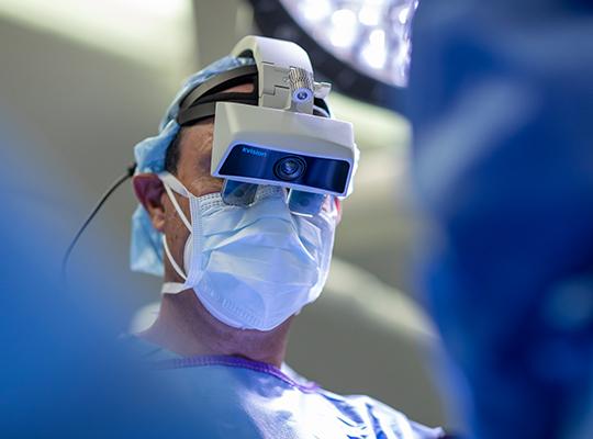 dr. frank phillips wearing augmedics xvision headset