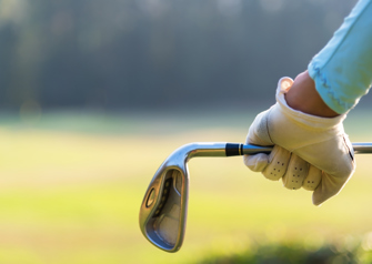 golfer holding golf club