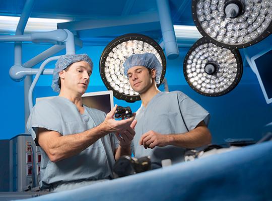 dr vasili karas and dr tad gerlinger in operating room