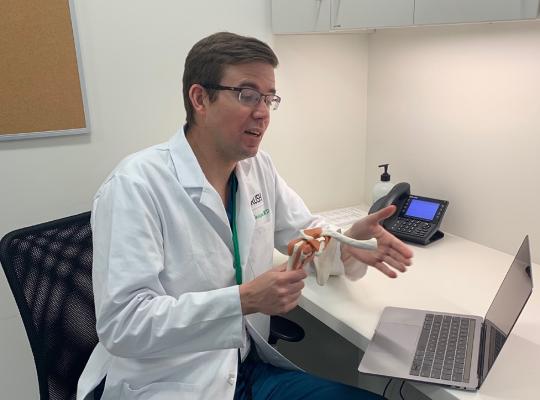 Dr. Grant Garrigues conducting a telemedicine visit 