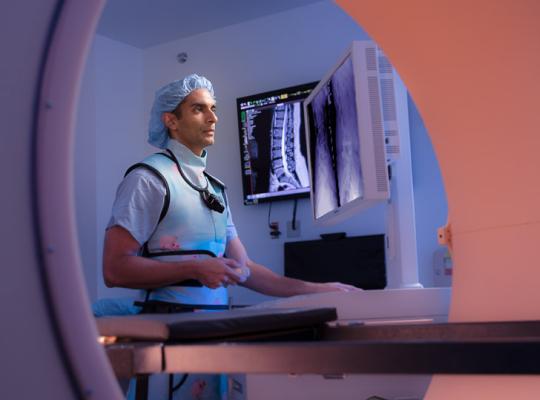 Dr. Kern Singh looking at patient imaging